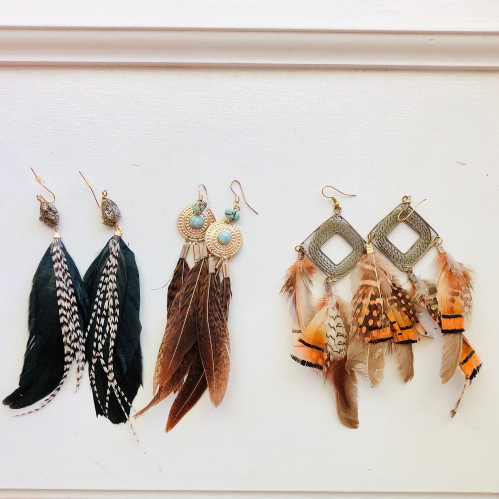 3 pairs of feather earrings.